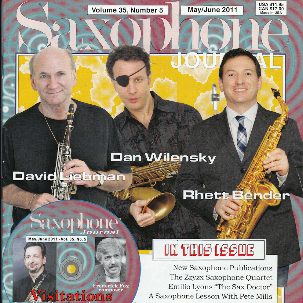 A magazine cover with three men playing saxophones.